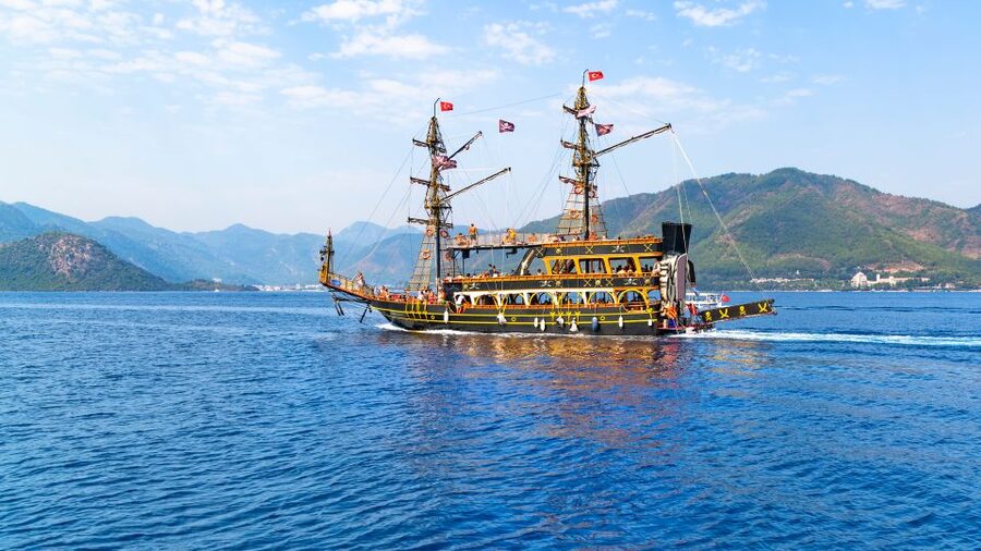 Red Dragon Pirate Boat Trip & Lunch - Snorkeling and Swimming Comfort: Shallow Water, Pebbles, and Shade